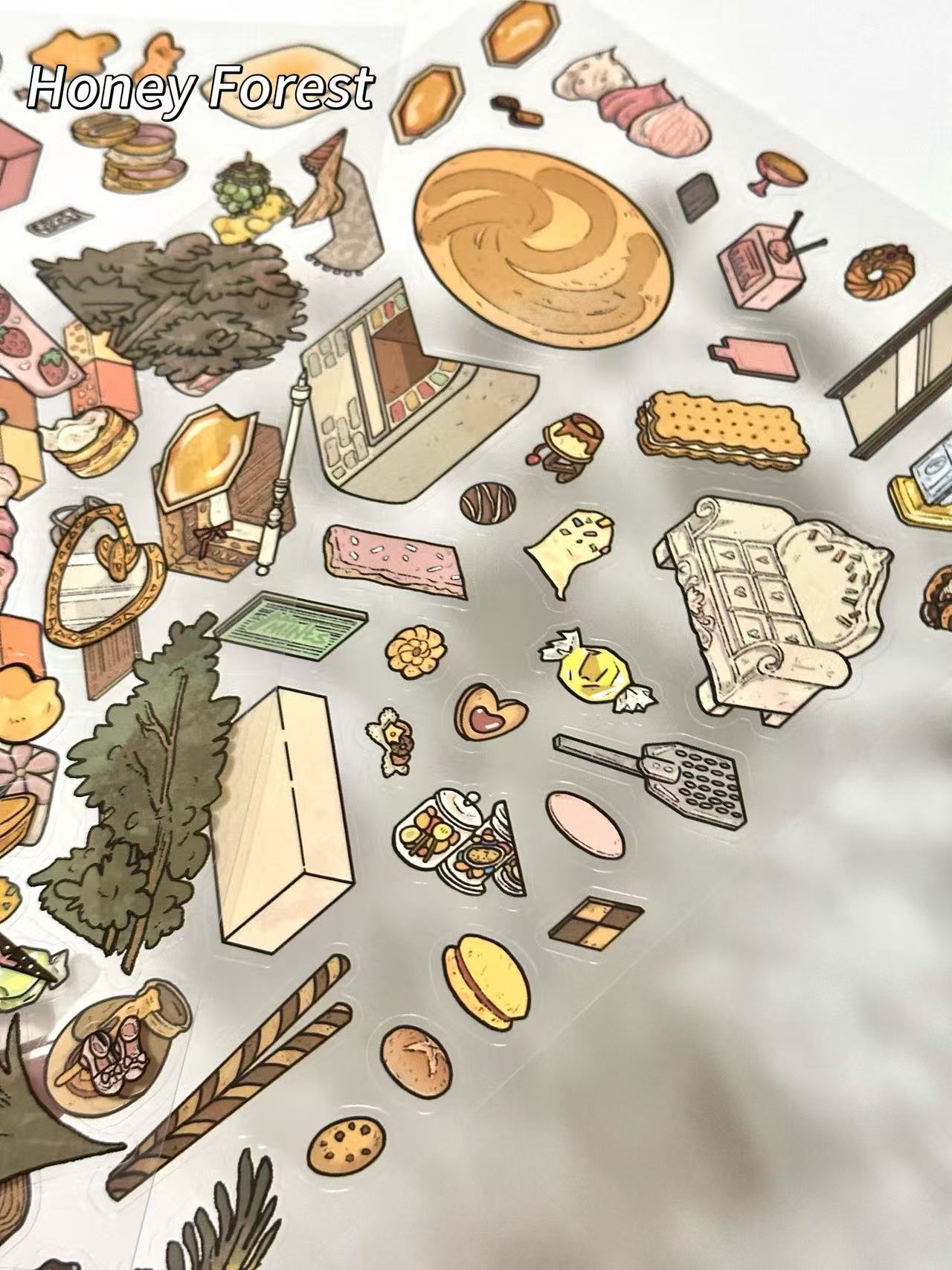 Colorful illustrated items on a white background with 'Honey Forest' branding.