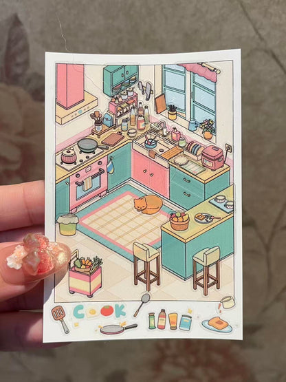 Illustration of a colorful kitchen with various appliances and furniture, held by a hand.