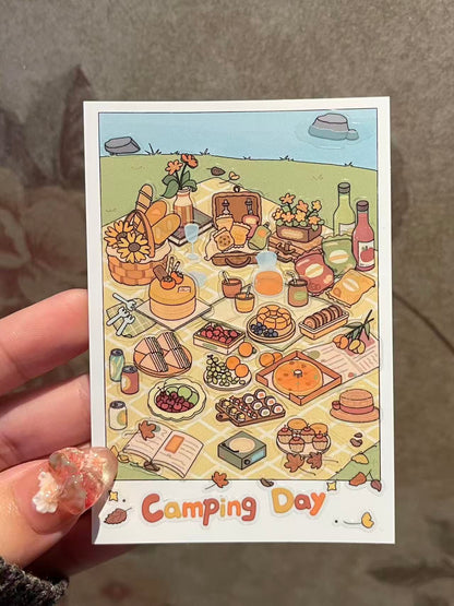 Illustrated card with a camping theme featuring food and outdoor items.
