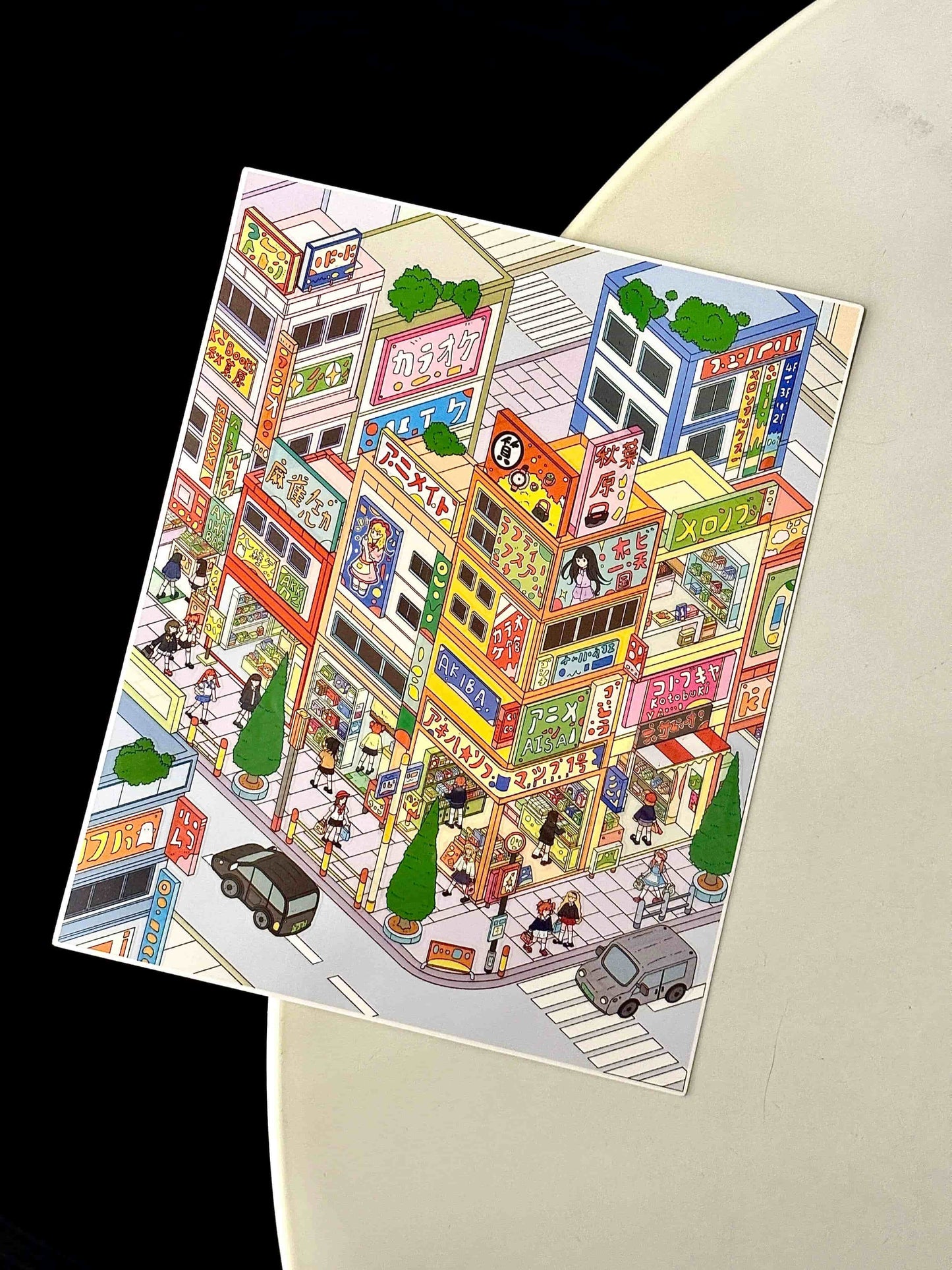 Illustration of a colorful city street scene on a piece of paper.