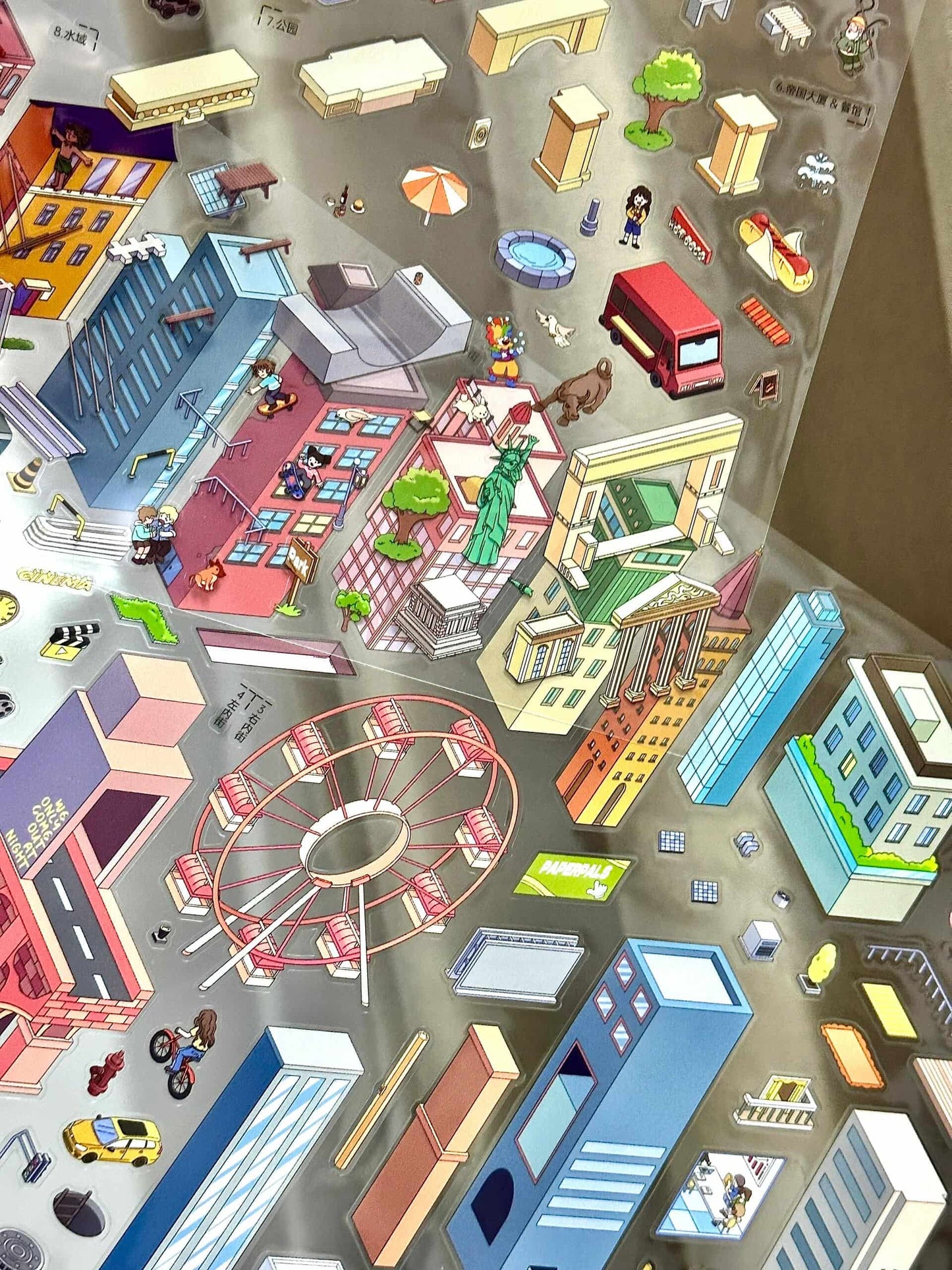 Colorful model of a city street with various buildings and objects.