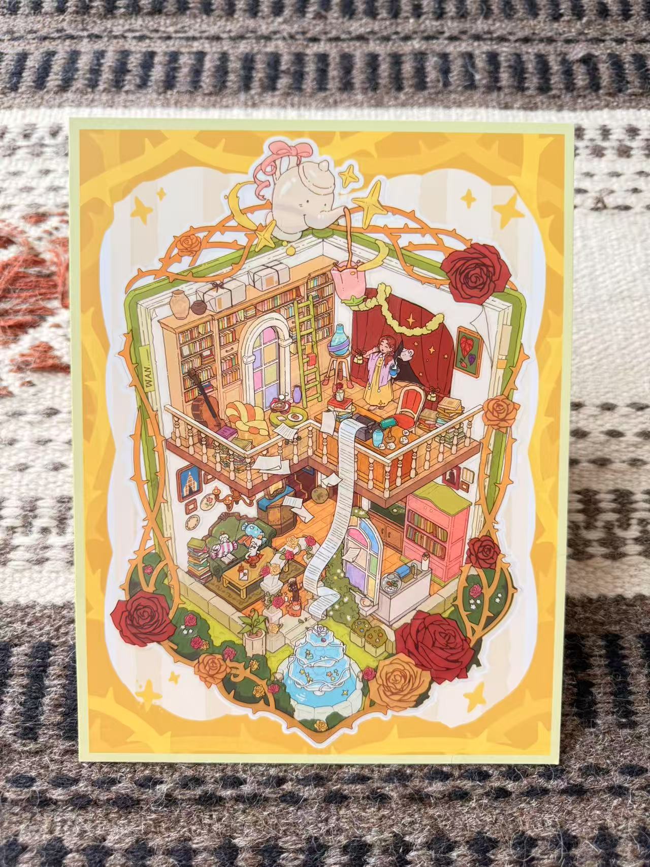 Illustrated miniature house with various rooms and decorative elements on a textured fabric background.